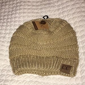 C.C tan beanie with gold accents, brand new
